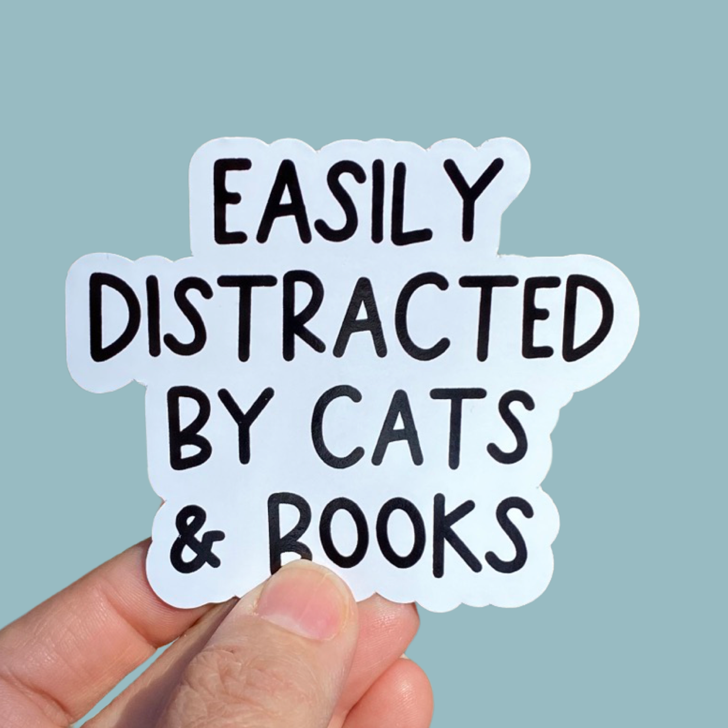 Easily distracted by cats and books sticker